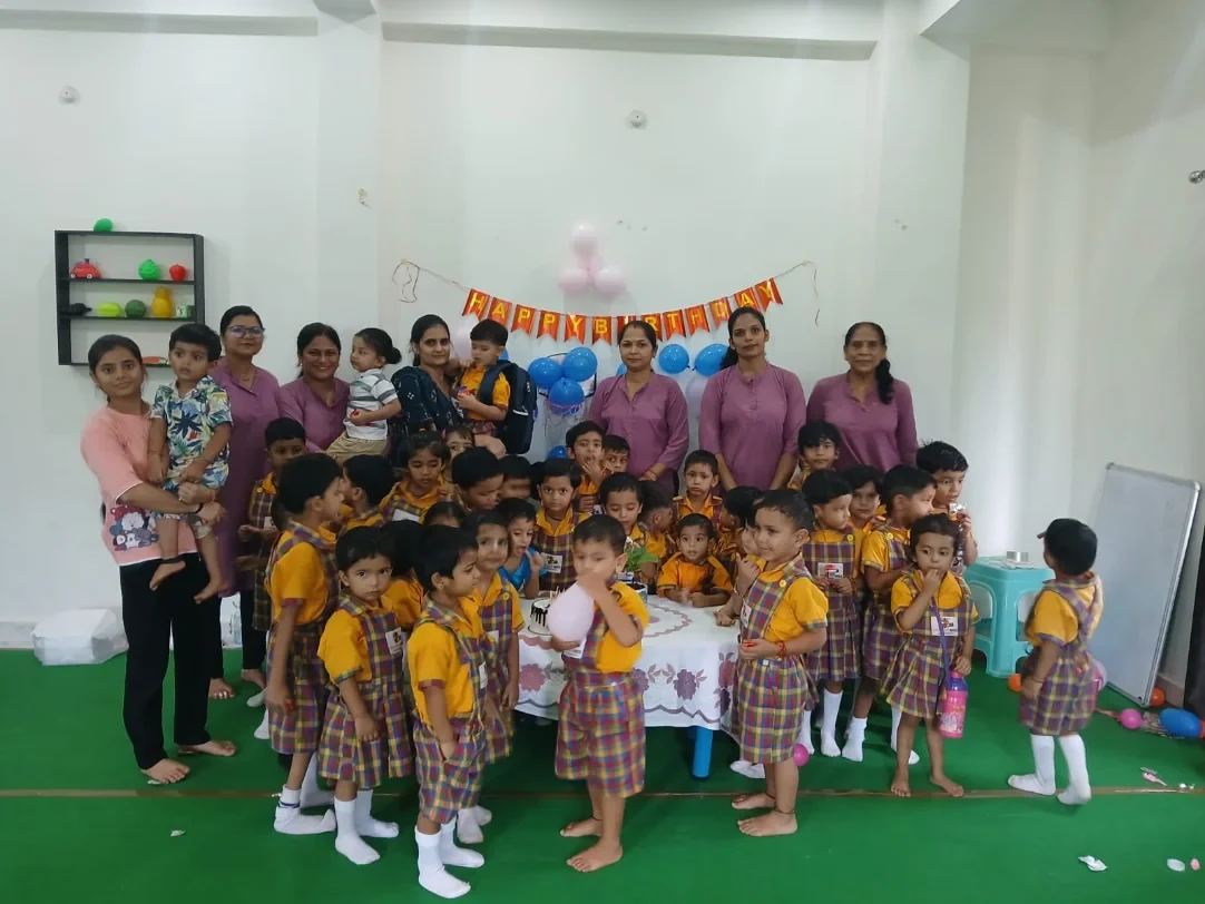 Children and teachers gathered together in the Wonder Bees school hall